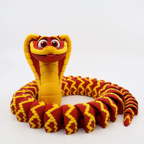 3D printed red and yellow cobra sensory toy for kids on a white background