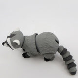 3D printed gray raccoon sensory toy with flexible joints on a white background