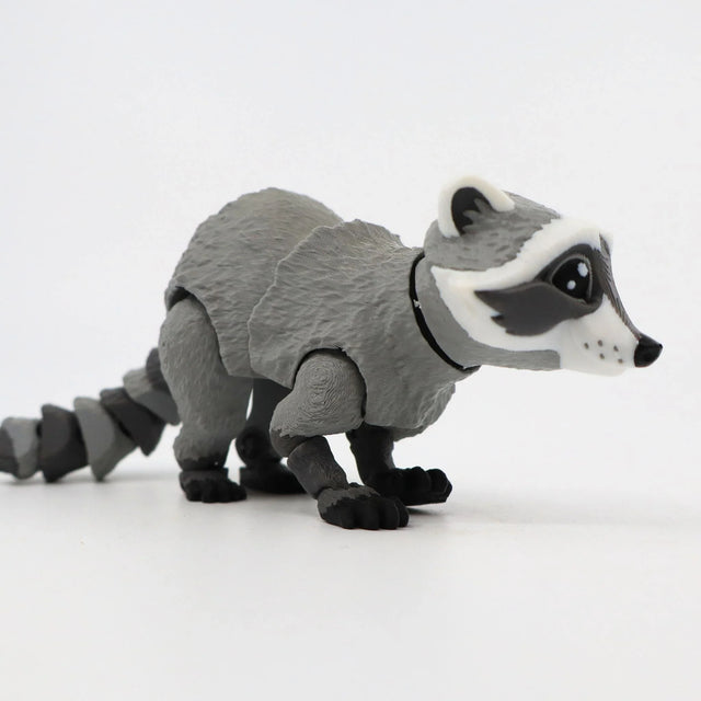 3D printed raccoon sensory toy with movable joints on a white background