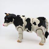 3D printed sensory cow toy with black and white spots, designed for tactile play
