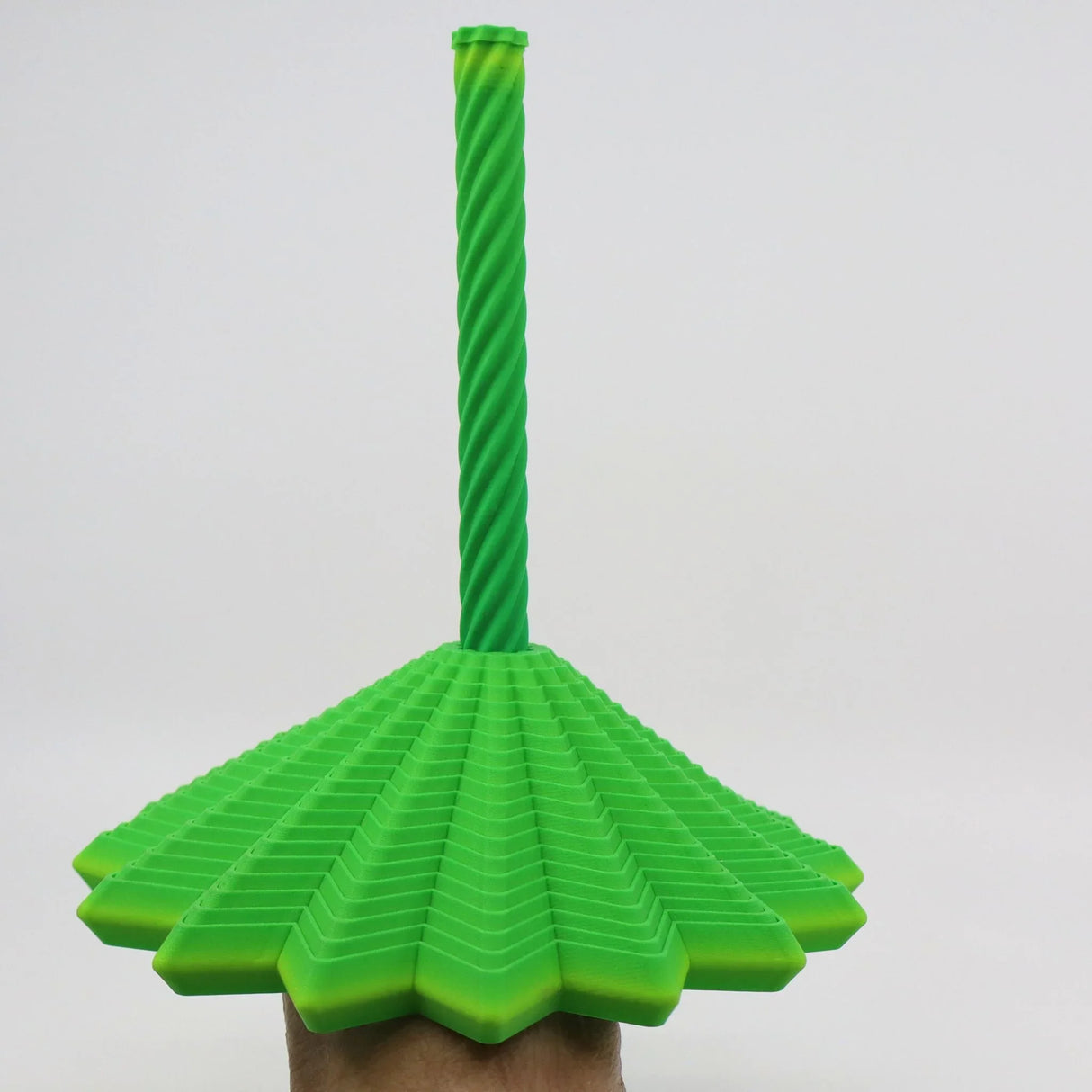 Green 3D printed sensory toy with textured star-shaped base and twisted vertical stem