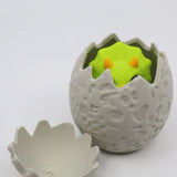 3D printed sensory toy dinosaur hatching from textured egg shell, for kids