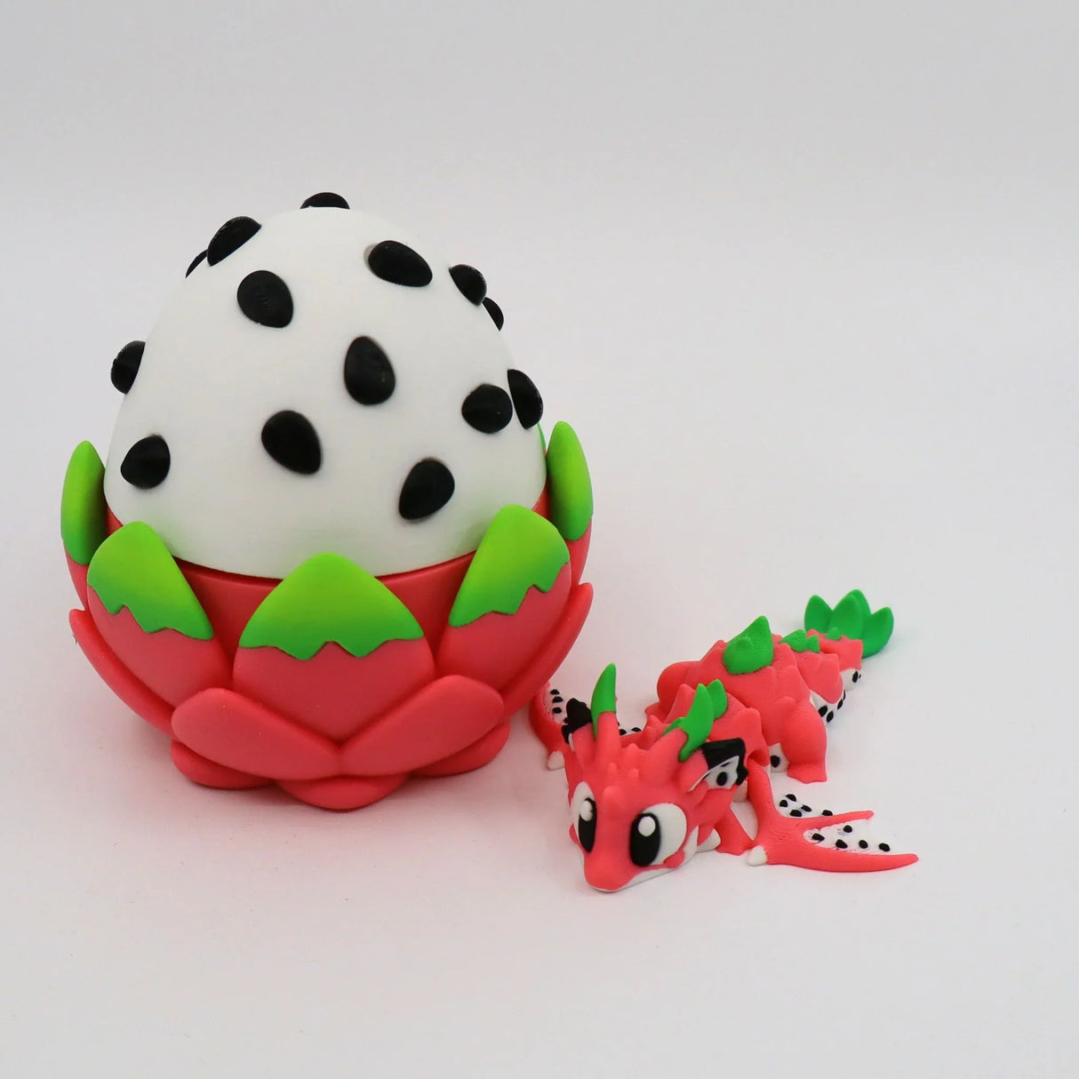3D printed dragon fruit egg sensory toy with a matching dragon figure, colorful and tactile