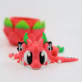 Cute 3D printed dragon fruit-inspired sensory toy with bright colors, large eyes, and textured details