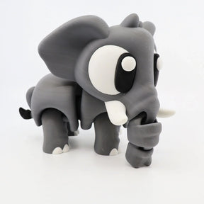 Cute gray 3D printed elephant sensory toy with big eyes and movable trunk on white background