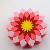 Colorful 3D printed flower puzzle toy with red, pink, and yellow sensory pieces