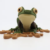 3D printed sensory frog toy with green body and light brown feet on white background