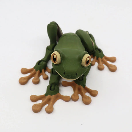 3D printed green frog sensory toy with tan webbed feet on a white background