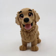 3D printed golden retriever fidget toy with textured fur, big eyes, and pink tongue for sensory play