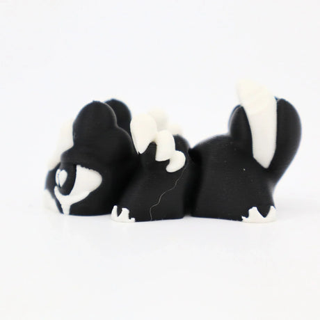 Black and white 3D printed flexi animal fidget toys for sensory play and tactile stimulation