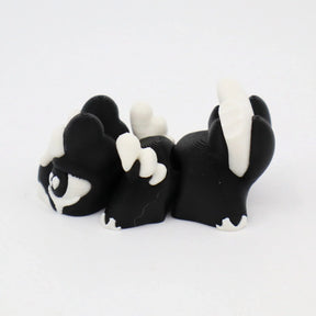 Black and white 3D printed fidget toy with textured surface for sensory play