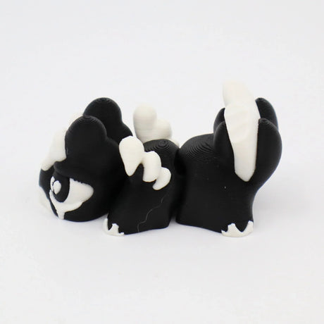Black and white 3D printed fidget toy with textured surface for sensory play