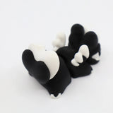 Black and white 3D printed fidget toy with textured sensory bumps for tactile play