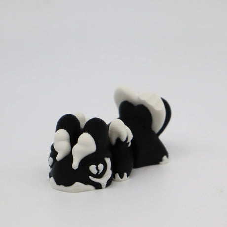 3D printed black and white skunk fidget toy for sensory play and stress relief