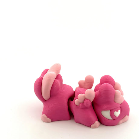 Pink 3D printed sensory animal toy with heart accents, tactile feet, for sensory play