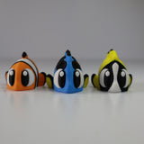 Colorful 3D printed fish sensory toys for kids, featuring orange, blue, and yellow designs