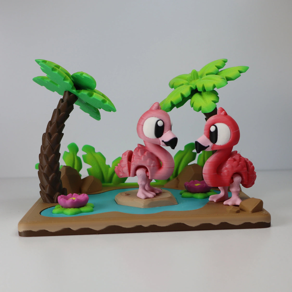 Colorful 3D printed flamingo sensory toy set with palm trees and pond for children