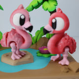 Colorful 3D printed flamingo sensory toys on a tropical playset with water and palm trees