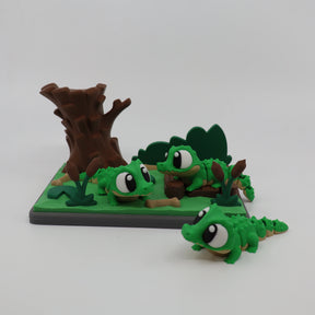 3D printed green alligator fidget toys with tree stump and marsh setting for sensory play