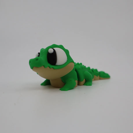 Green 3D printed alligator fidget toy for sensory play