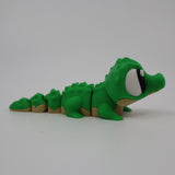 Green 3D printed alligator fidget toy with textured segments for sensory play