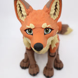 3D printed orange and brown fox sensory toy with detailed fur texture, sitting on white background