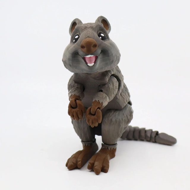 3D printed brown quokka sensory toy with articulated limbs and smiling face on white background.