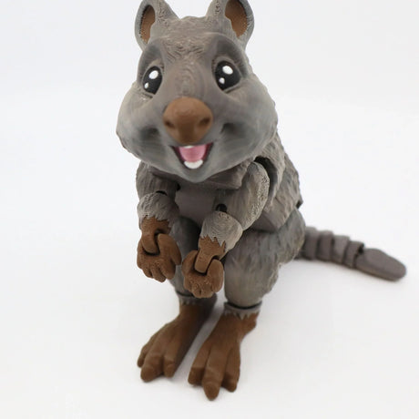 3D printed sensory toy quokka with moveable limbs, textured gray fur, and cute smiling face