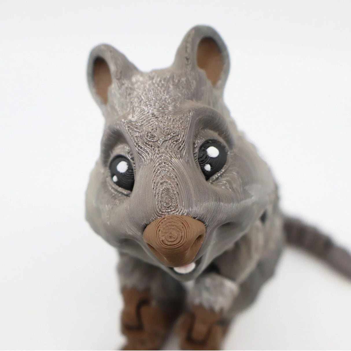 3D printed quokka sensory toy with textured gray and brown finish, close-up view