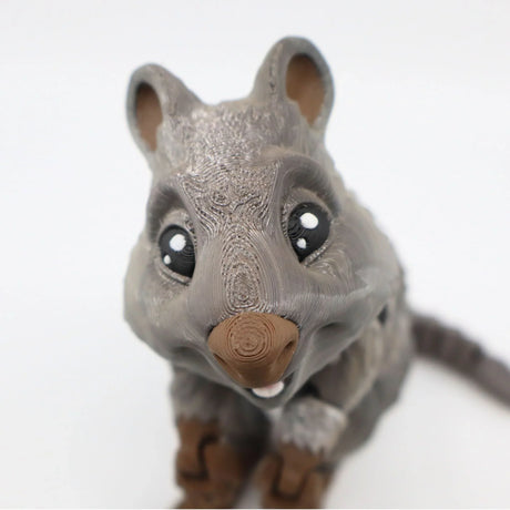 3D printed quokka sensory toy with textured gray and brown finish, close-up view