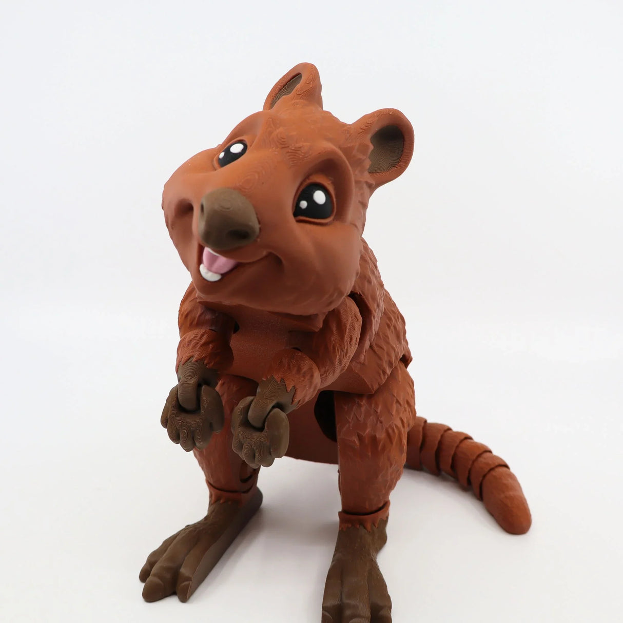 Cute brown 3D printed quokka sensory toy with articulated limbs on white background