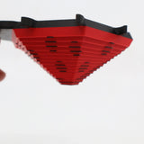 Red and black 3D printed ladybug sensory toy with layered, hexagonal design