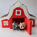 3D printed red toy barn with cute sensory goat and cow figures at the entrance