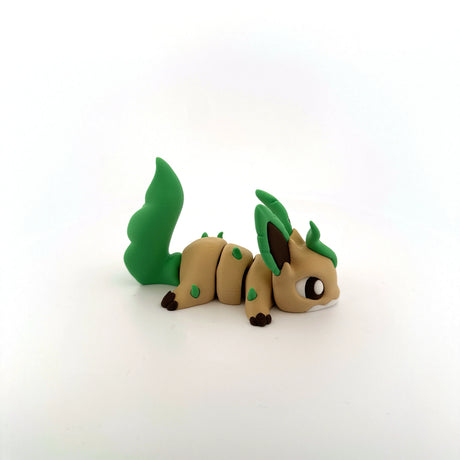 3D printed sensory toy resembling a cute, leafy animal with green tail and ears on white background.