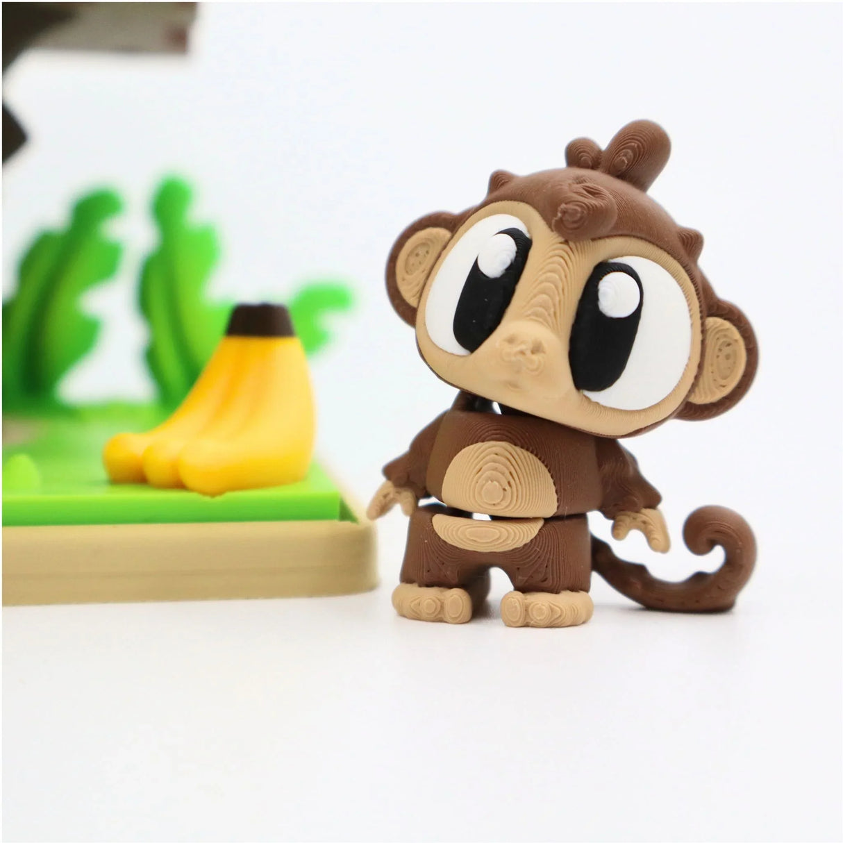 Cute 3D printed monkey sensory toy with bananas, educational and tactile design