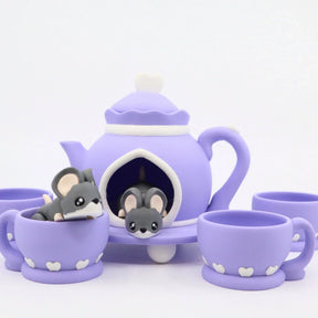 Purple 3D printed tea set with cute mouse toys in teapot and cups, sensory play set