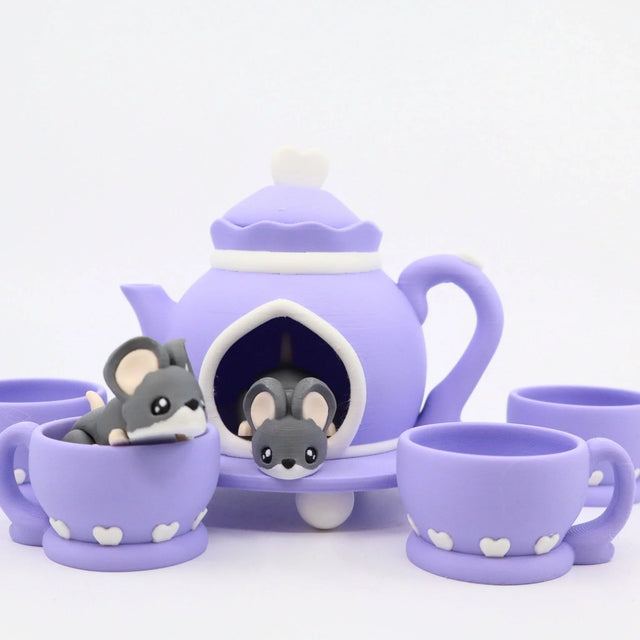 Purple 3D printed tea set with cute mouse toys in teapot and cups, sensory play set
