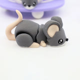Gray 3D printed mouse sensory toy with large ears and curled tail on white background