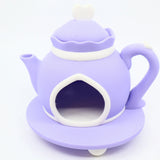 Purple 3D printed teapot toy with white accents for sensory play and imaginative learning
