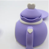 Purple 3D printed sensory toy teapot with white heart details, playful and kid-friendly design