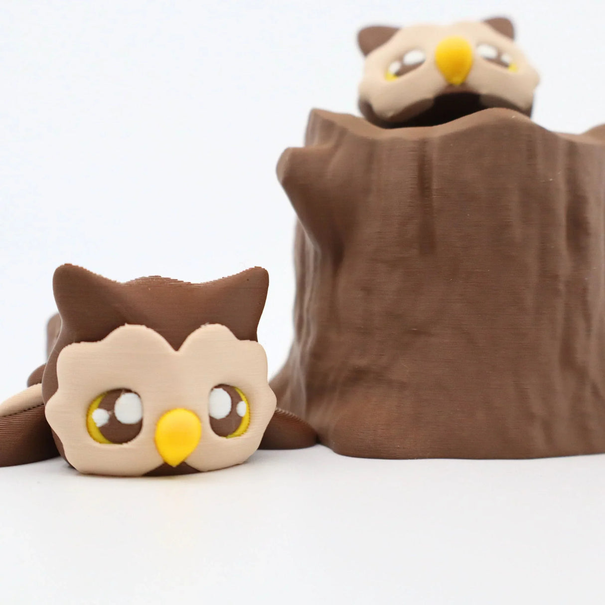 3D printed owl sensory toy with tree stump, brown and yellow, for sensory play
