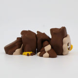 Brown 3D printed sensory owl toy with yellow beak and feet, shown on white background