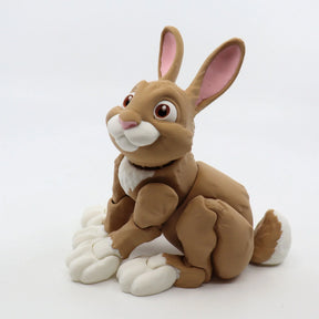 3D printed brown rabbit sensory toy with white accents and large paws on white background