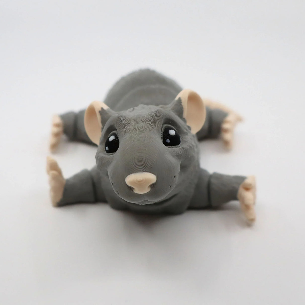 3D printed gray rat sensory toy with cute face, large eyes, and poseable limbs on white background
