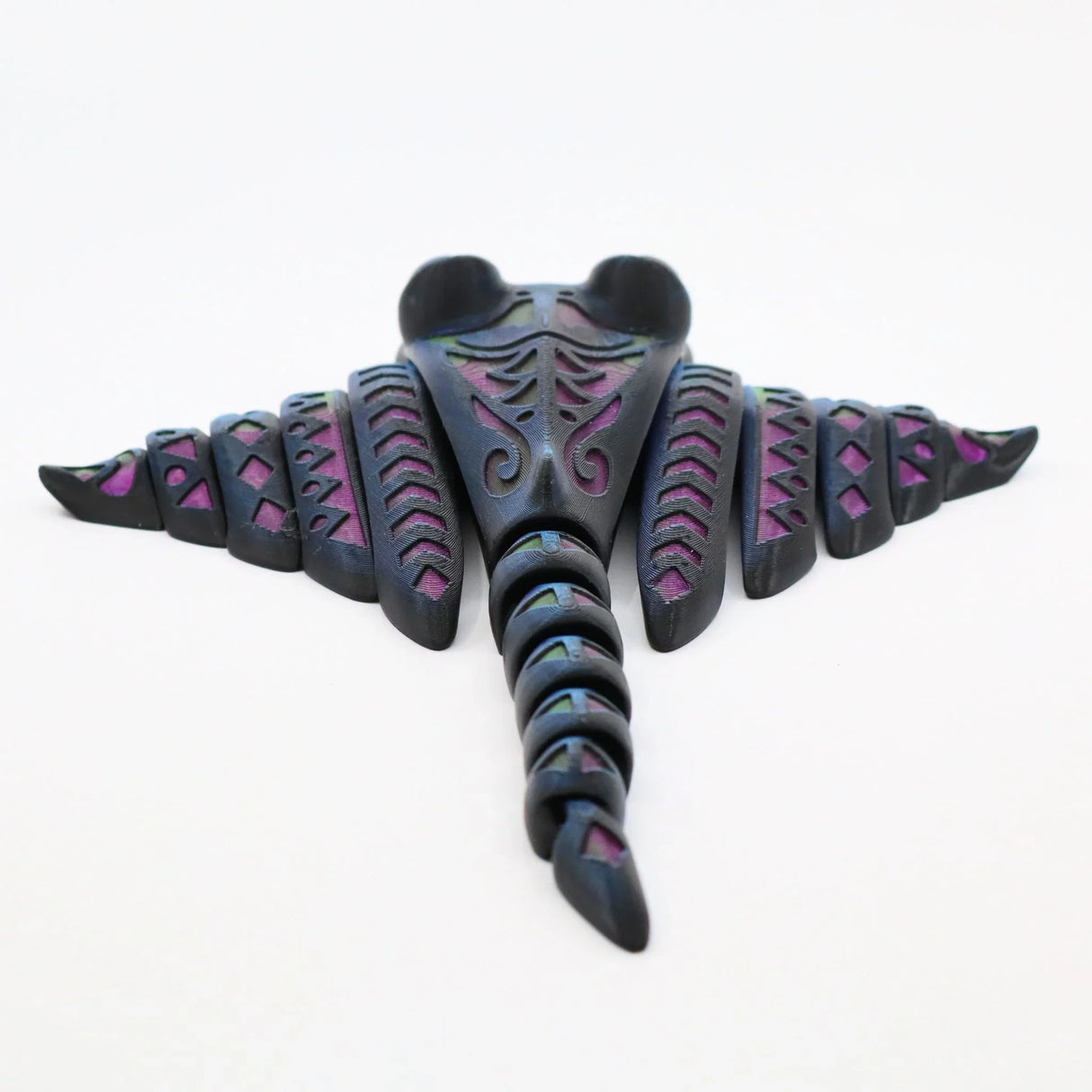 Colorful 3D printed sensory stingray toy with geometric patterns on white background