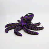 Purple 3D printed mechanical octopus fidget toy with articulated tentacles for sensory play