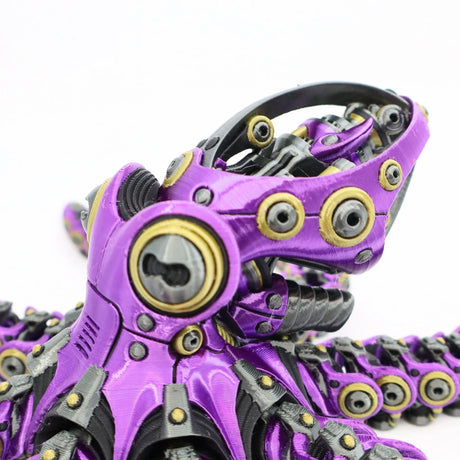 Purple 3D printed fidget toy with mechanical joints and gold accents for sensory play