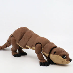 Brown 3D printed sea otter sensory toy with movable joints on a white background