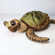 3D printed sensory sea turtle toy with green shell and textured flippers on white background