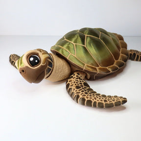 3D printed sensory sea turtle toy with green shell and textured flippers on white background